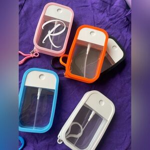 Silicone Soray bottle keychain Set - Blue, Orange, Black, White